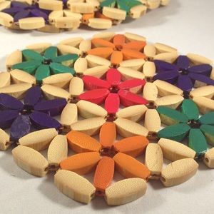 4 red, green, and purple retro wood trivets
